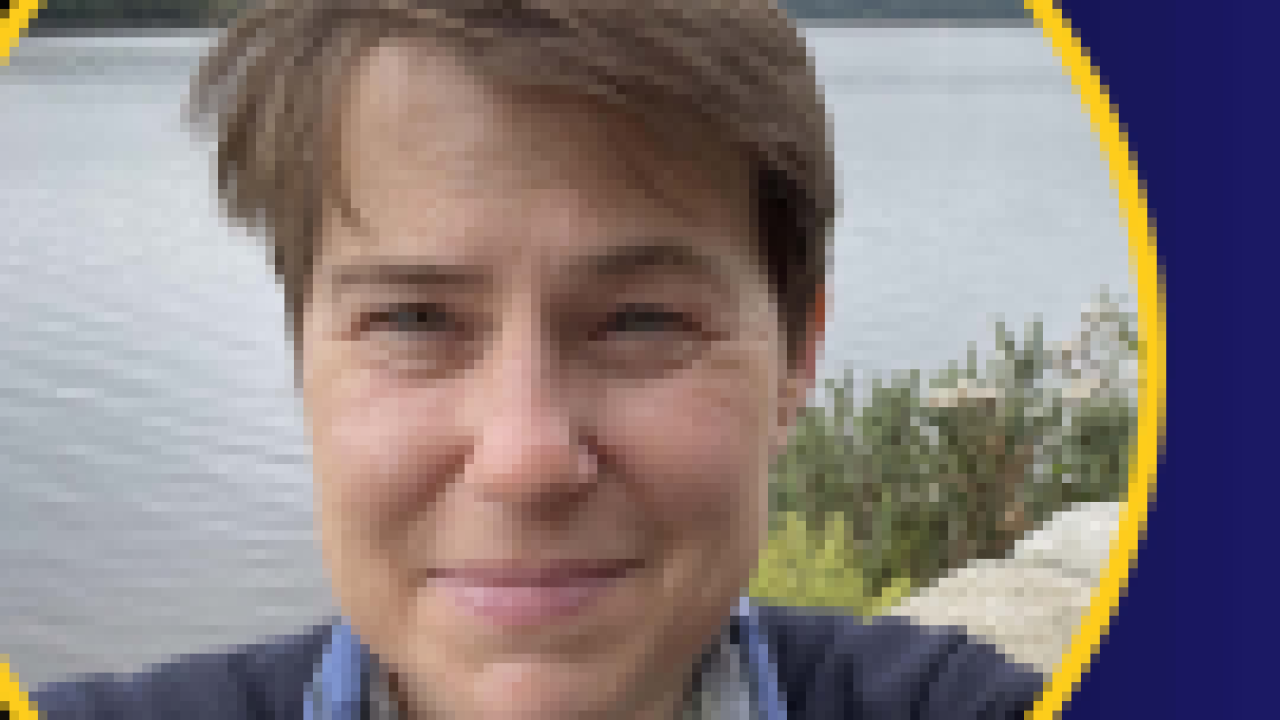 A photo of woman by a body of water, with a dark blue circular border