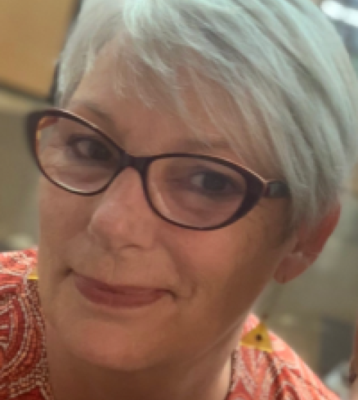 A woman wearing glasses.