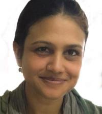 A photo of a woman smiling at the camera