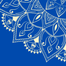 An ornate white floral pattern on a blue background