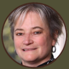 a photo of a woman with short gray hair