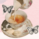 a tea cup with butterflies and tea.