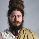 A photo of a man with facial hair.