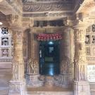 Intricately carved stone entrance with ornate pillars and decorative elements.